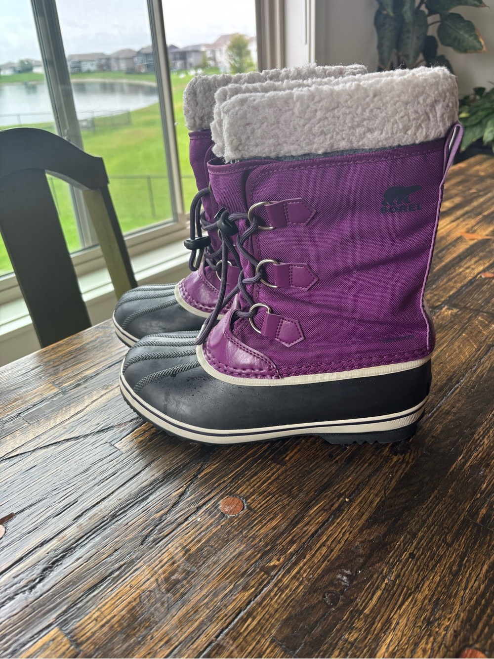 Sorel Purple and Black Waterproof Snow Boots waterproof fits like a size 6